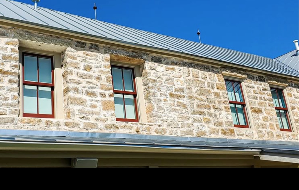 Second-story windows on a Hill Country stone building